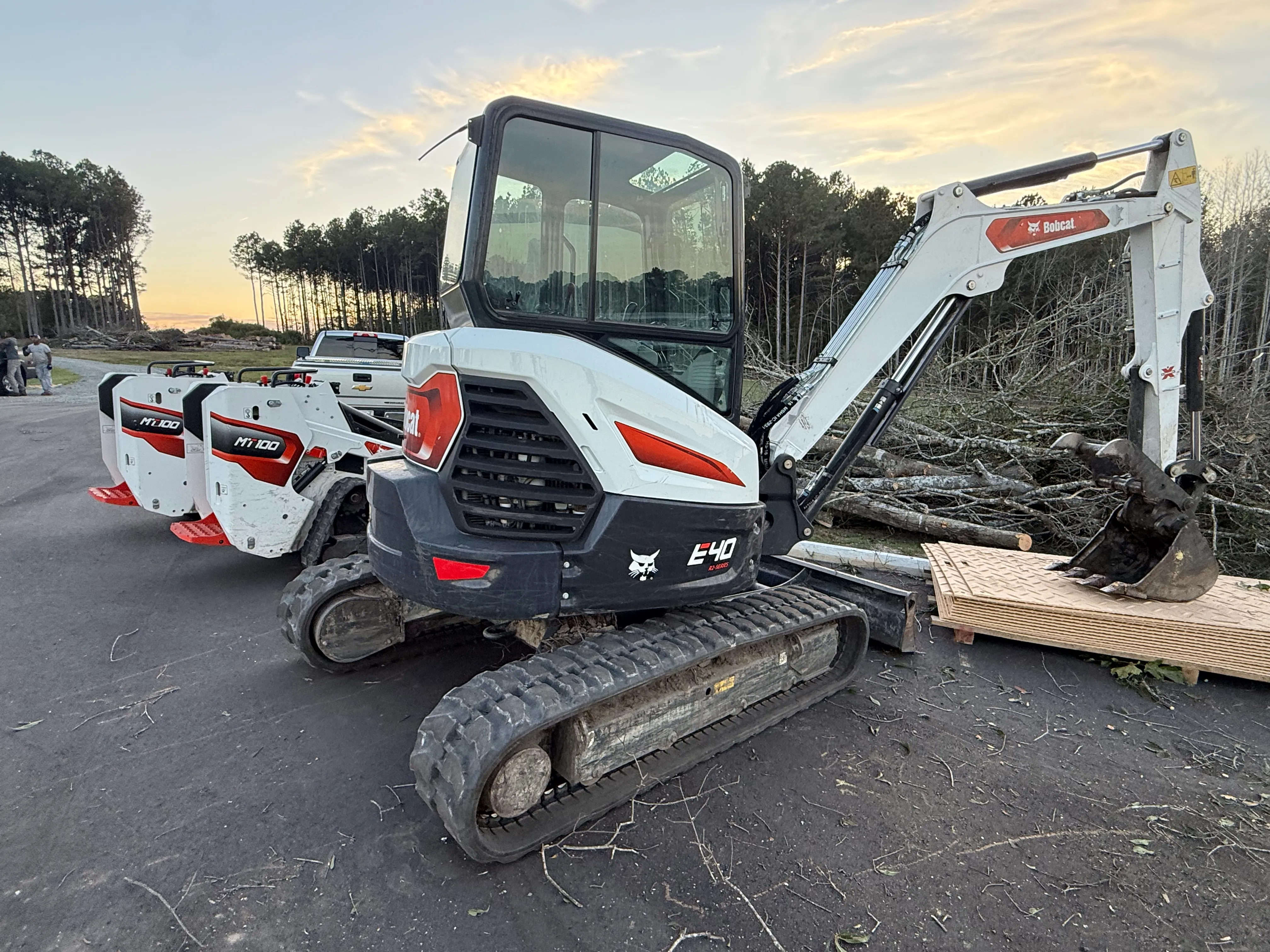 Excavator and compact track loader at a construction site